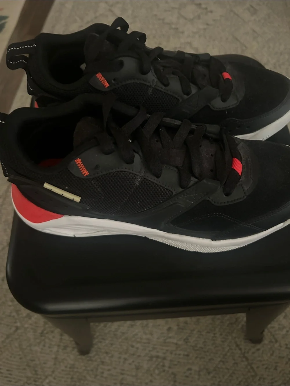 Women’s Jordans Black Athletic Sneakers with Red Accents